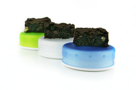 Three medium GoTubbs shown with medical cannabis edibles. Contribute to child resistant packaging for cannabis.