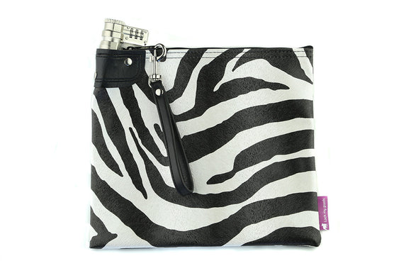 Zebra print bag shown with black wrist strap.
