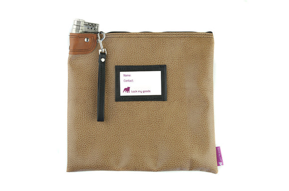 Brown leather locking medication bag shown with leather strap. With combination lock. Provides travel safety and child resistant packaging. 