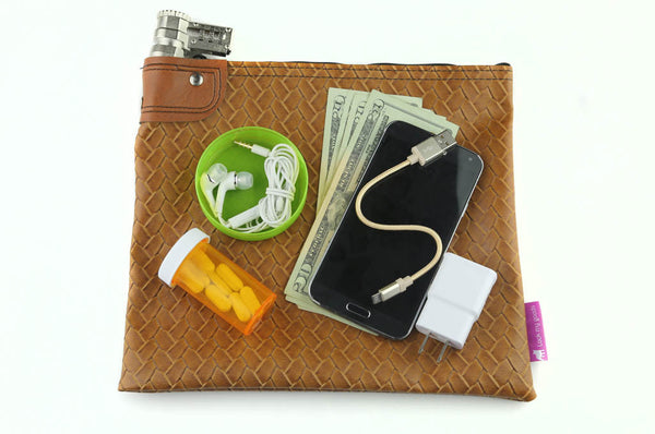 Bourbon, caramel hatch-pattern bag, shown with props