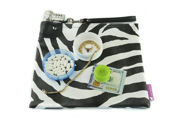 Zebra print locking bag shown with medication and jewelry.