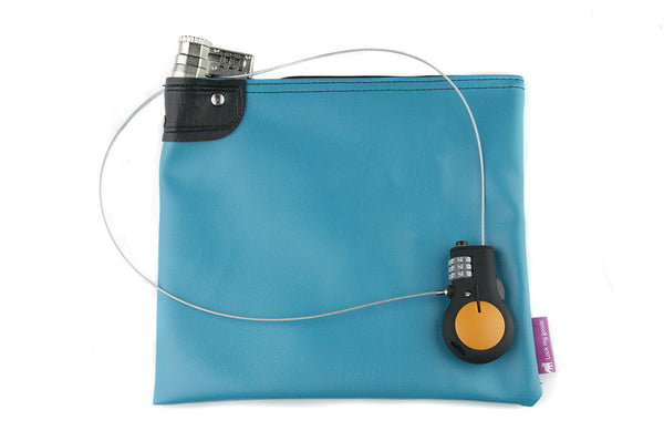 Teal locking bag shown with Lewis N Clark, retractable cable lock. 