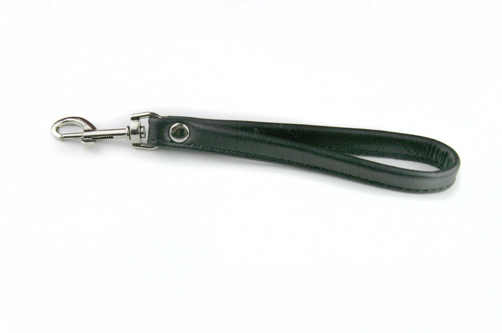 Genuine leather, black wrist strap with silver hook. Also works as purse strap.