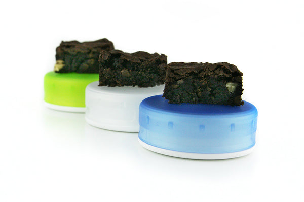 Three medium GoTubbs shown with medical cannabis edibles. Contribute to child resistant packaging for cannabis. 